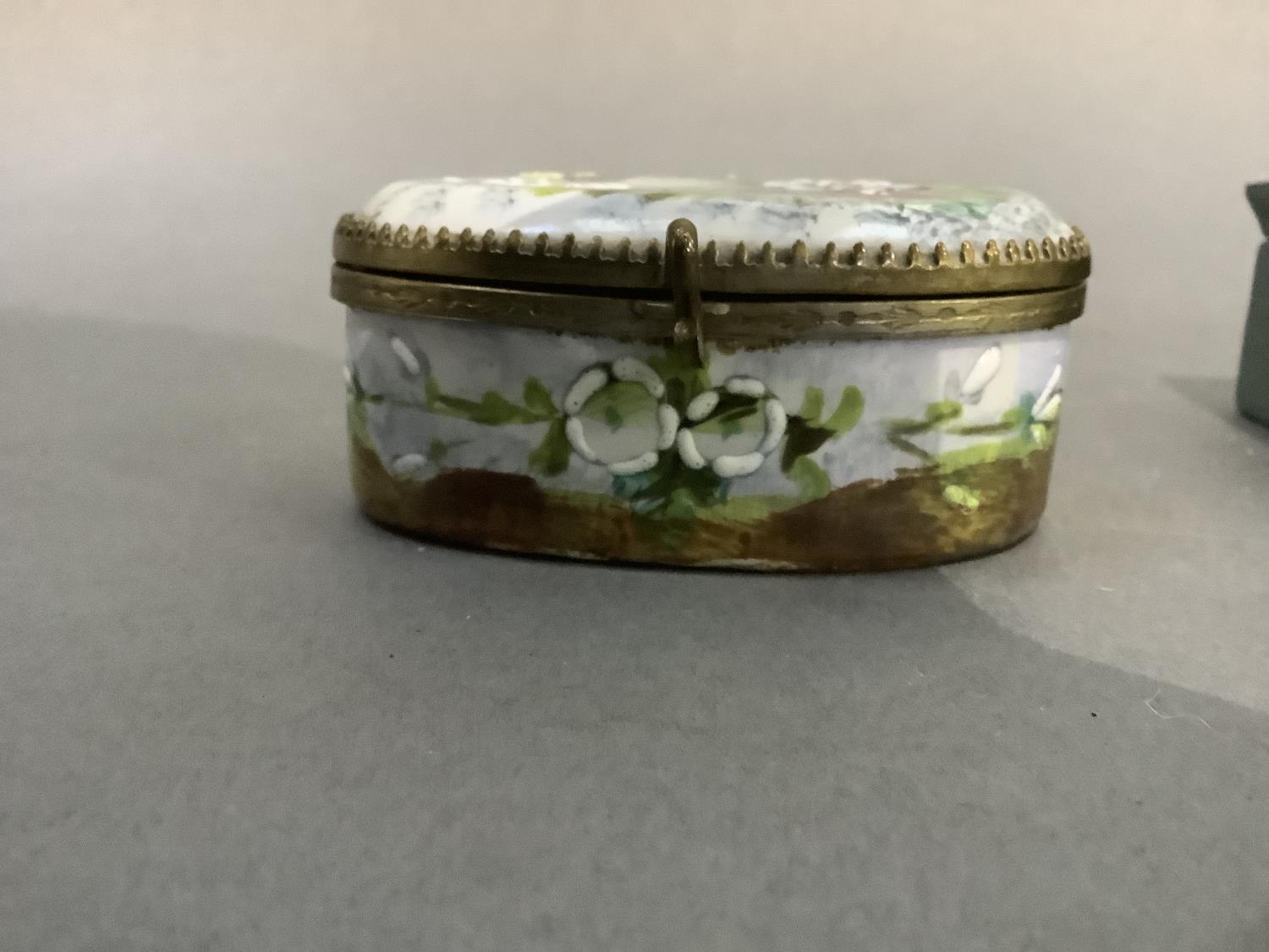 A late 19th century china jewel casket of oval outline painted with flowers and butterflies to the - Image 3 of 4