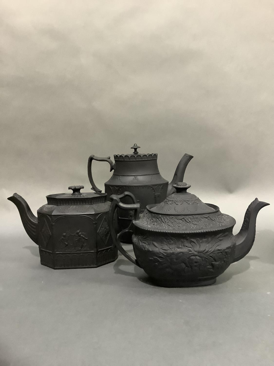 Three black basalt teapots, two of neo-classical design, oval and octagonal outline, the third - Image 2 of 3