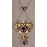 A Late Victorian amethyst and seed pearl heart shaped pendant and chain in 9ct gold, the oval
