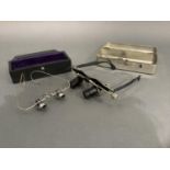 A stainless steel cased set of surgeon's micro lens glasses by Lempertstorz, Germany and an