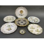Six various Majolica wall plates and an Italian yellow, blue and green pedestal dish pierced and