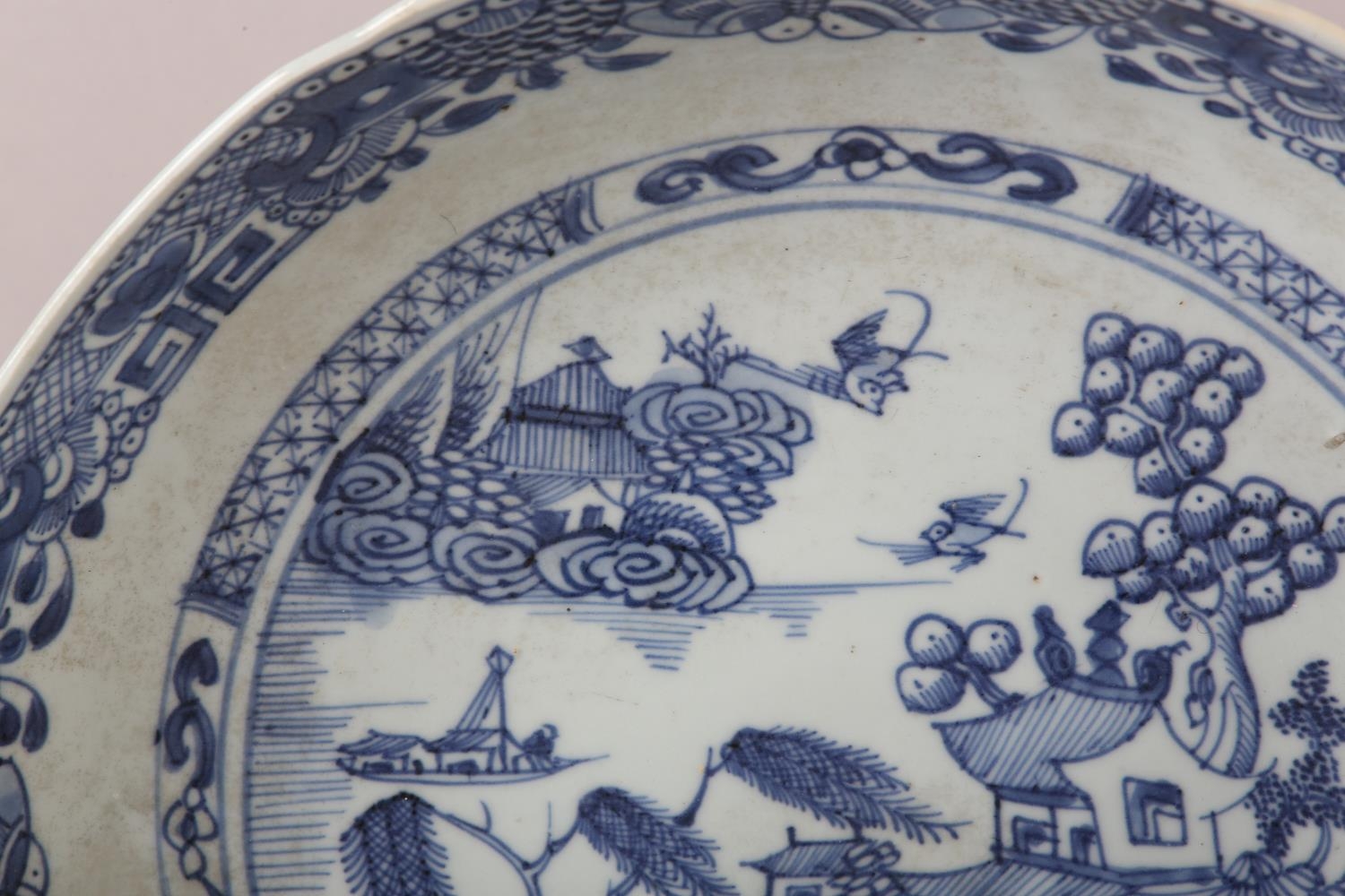 A Chinese blue and white saucer dish painted with pagoda, pine tree and willow tree in a river and - Image 3 of 3