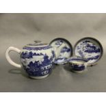 A Chinese export blue and white teapot painted with a pagoda river landscape together with a tea