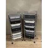 Two tubular metal framed trollies each containing ten pull out trays in grey, black and cream