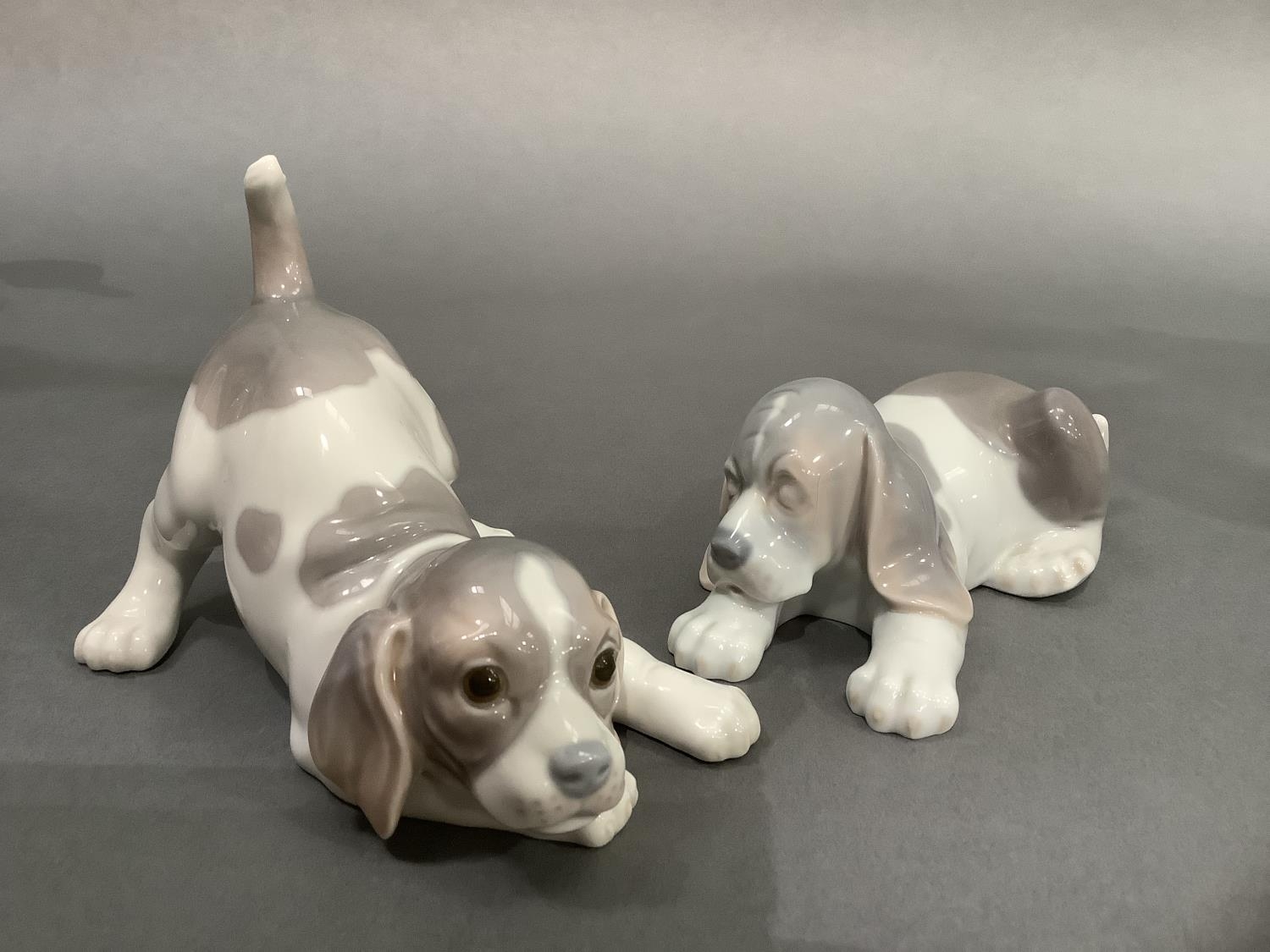 Two Lladro puppies, 11cm high and 7cm