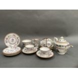 A Royal Worcester tea service printed and enamelled with flowering tendrils comprising six cups, six