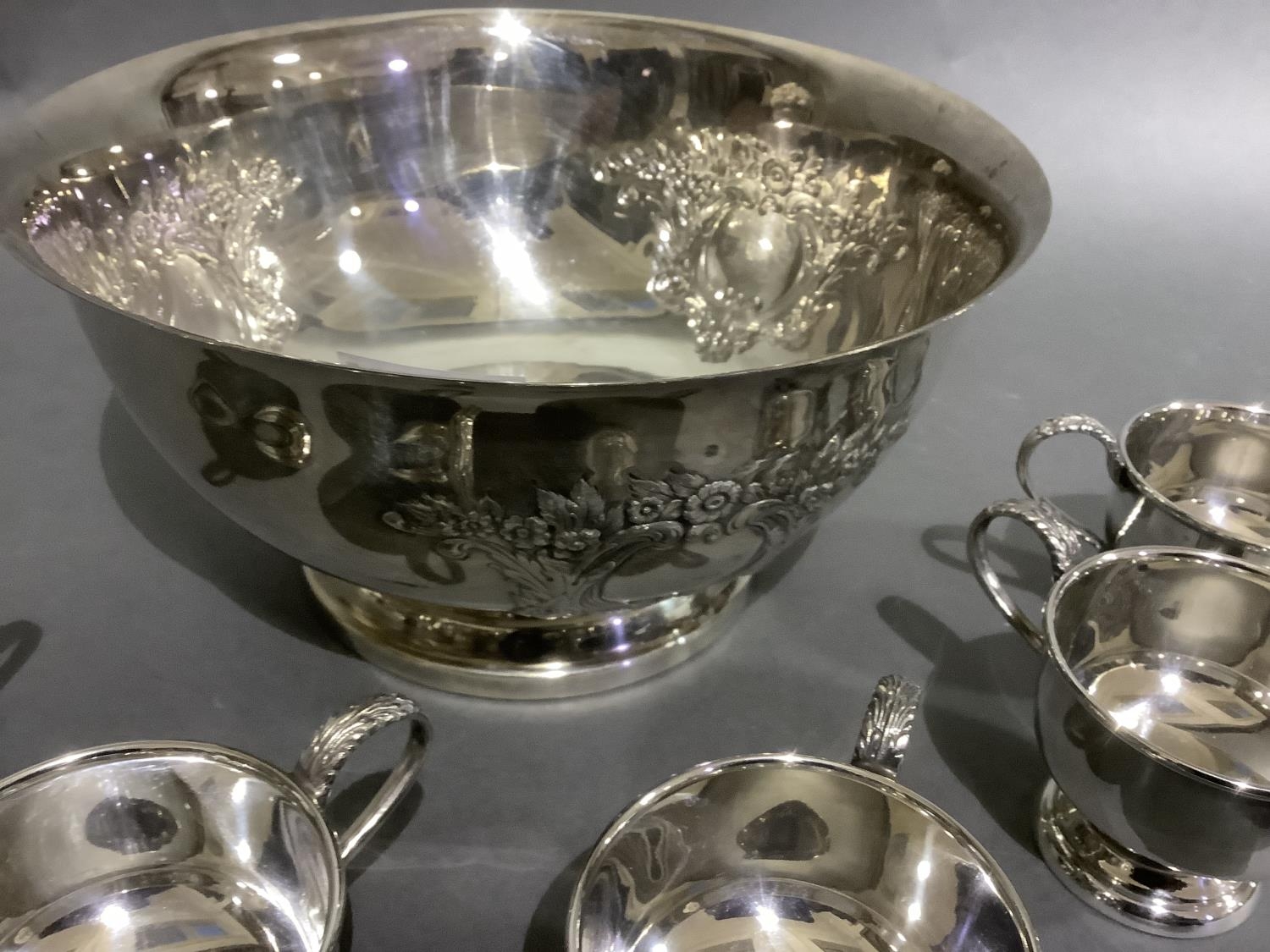 A good silver plated punch bowl with six cups and ladle, embossed with flowers and blind cartouche, - Image 4 of 5