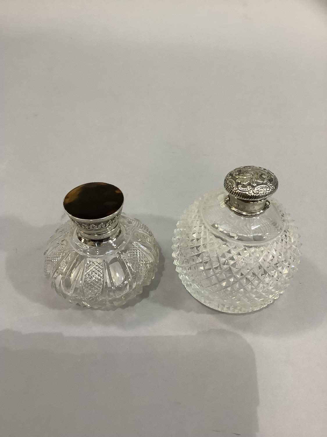 A GLOBULAR DIAMOND CUT GLASS SCENT BOTTLE with silver collar and repousse detachable top, Birmingham - Image 2 of 4