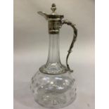 A star etched glass claret jug with plated collar and branch handle, 27cm high