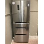 An LG stainless steel fridge freezer, as new, (a small dent to one of the front doors seen)