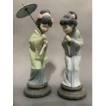 Two Lladro geishas, one with umbrella, 30cm and 27cm high