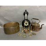 A copper kettle of oval outline, a two handled copper planter, a late 19th century ebonised