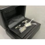 A pair of diamond set cufflinks in silver, each rectangular polished and frosted face set with three