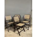A set of four bergere caned folding chairs