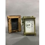 A brass carriage clock with white enamel dial in original red morocco case complete with key, 15cm
