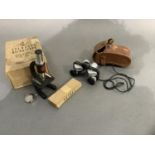 A student's microscope and a small pair of binoculars by Baker Clearview no.7930 6 x 15mm in leather