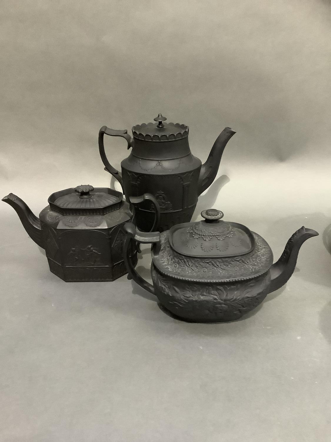 Three black basalt teapots, two of neo-classical design, oval and octagonal outline, the third - Image 3 of 3