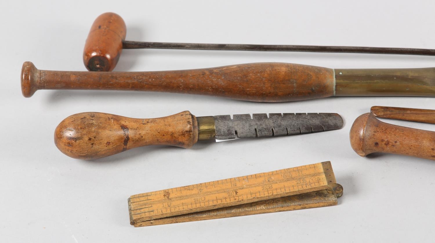 A collection of 19th century hardwood and brass mounted leather working tools, two with agate heads, - Image 2 of 4