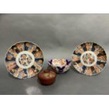 Two late 19th century Imari dishes of fluted circular form and typical palette, a circular bowl (A/