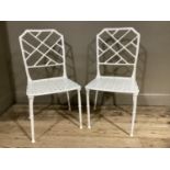 A pair of white metal bamboo effect garden chairs