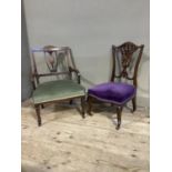 An Edwardian mahogany and satinwood inlaid nursing chair having a pierced back with vase splat and