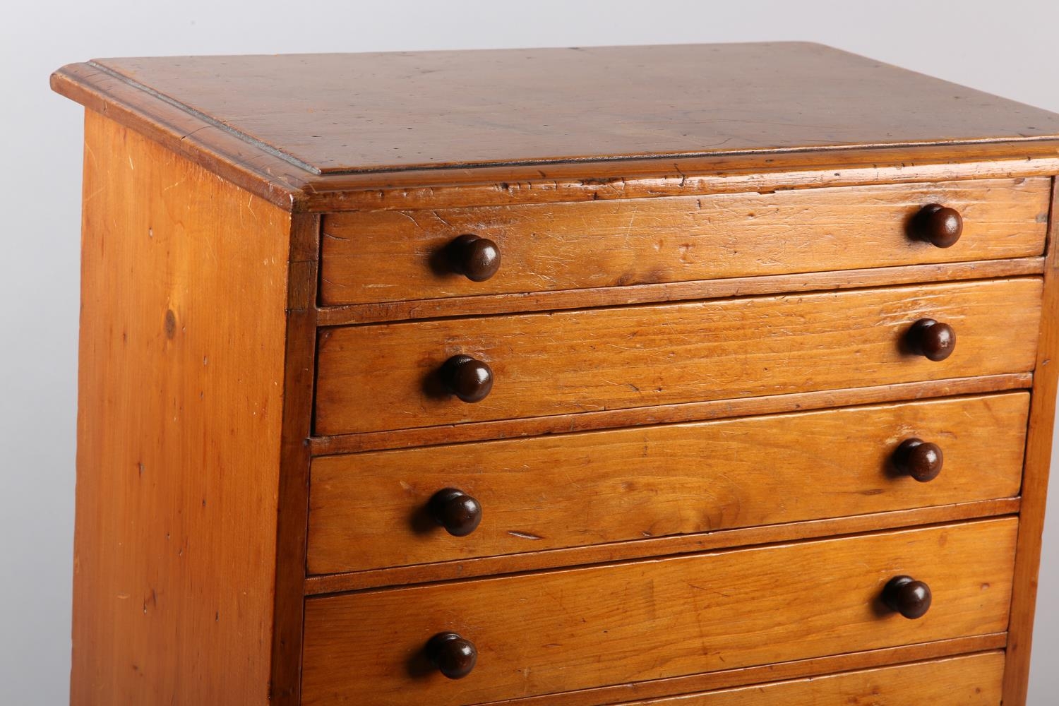 A Victorian mahogany specimen chest of seven graduated drawers with turned button handles, on plinth - Image 2 of 3
