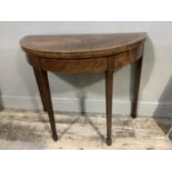 An Edwardian mahogany and crossbanded demi lune card table having a fold over top lined with baise