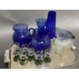 Two blue glass water jugs, vase, hyacinth vase, 1970s studio glass dish, set of four Whitefriars