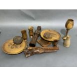 A collection of treen including goblets, circular box carved in low relief with blossom and