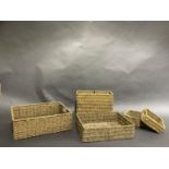 Five woven baskets, rectangular, oblong and square, some with handles