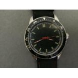 A 1960's style wristwatch in chromed case, quartz movement with green batons and red hands within