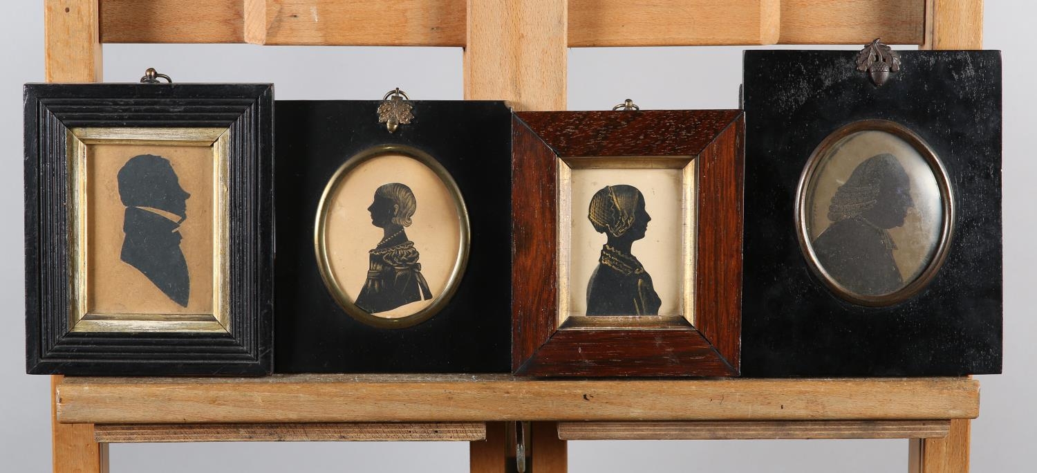 A Victorian silhouette of a young woman detailed in gilt, 7.5cm x 5.75cm, rosewood frame together