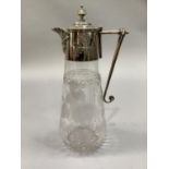 An Edwardian cut glass claret jug etched with vine leaves with plated collar and handle, 29cm high