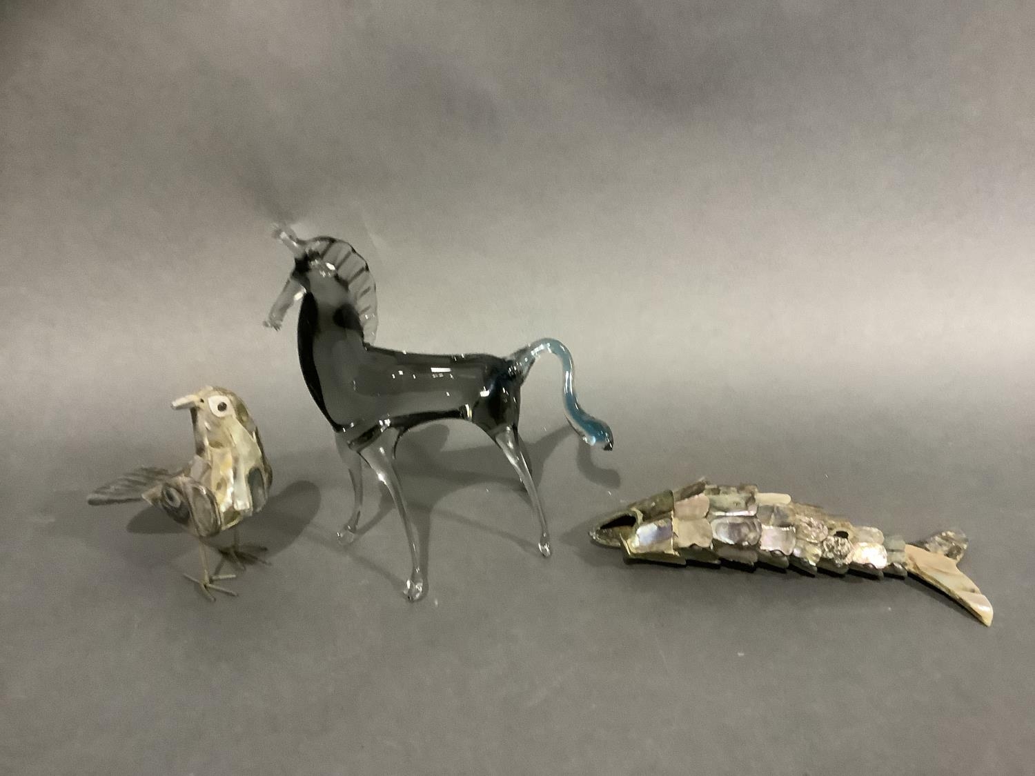 An Italian glass figure of a horse together with a abalone articulated fish and an abalone model
