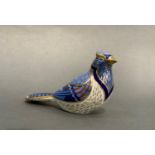 A Royal Crown Derby paperweight in the form of a crested bird with a blue plumage, gilt button, ,