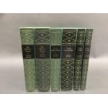 Six volumes of the works of Charles Dickens printed by the Folio Society and in green slip cases