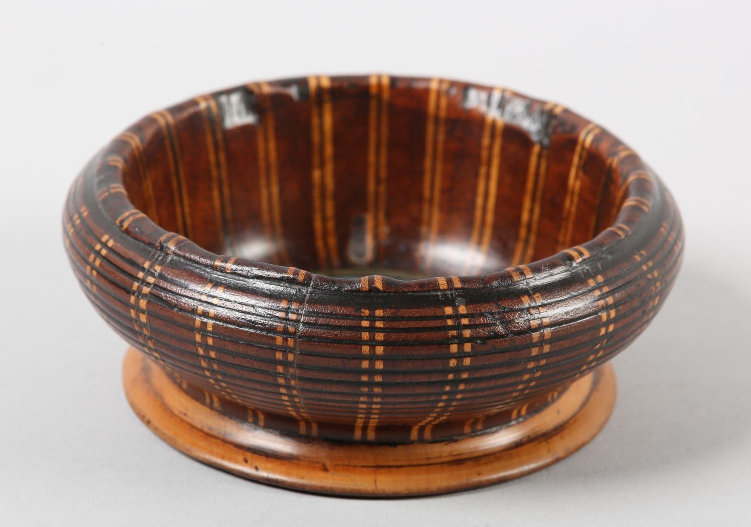 A Late 19th century turned walnut bowl, inlaid in boxwood and ebony vertical banding, the well inset