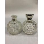 TWO GLOBULAR DIAMOND CUT GLASS SCENT BOTTLES with silver collars and hinged tops, Birmingham 1913