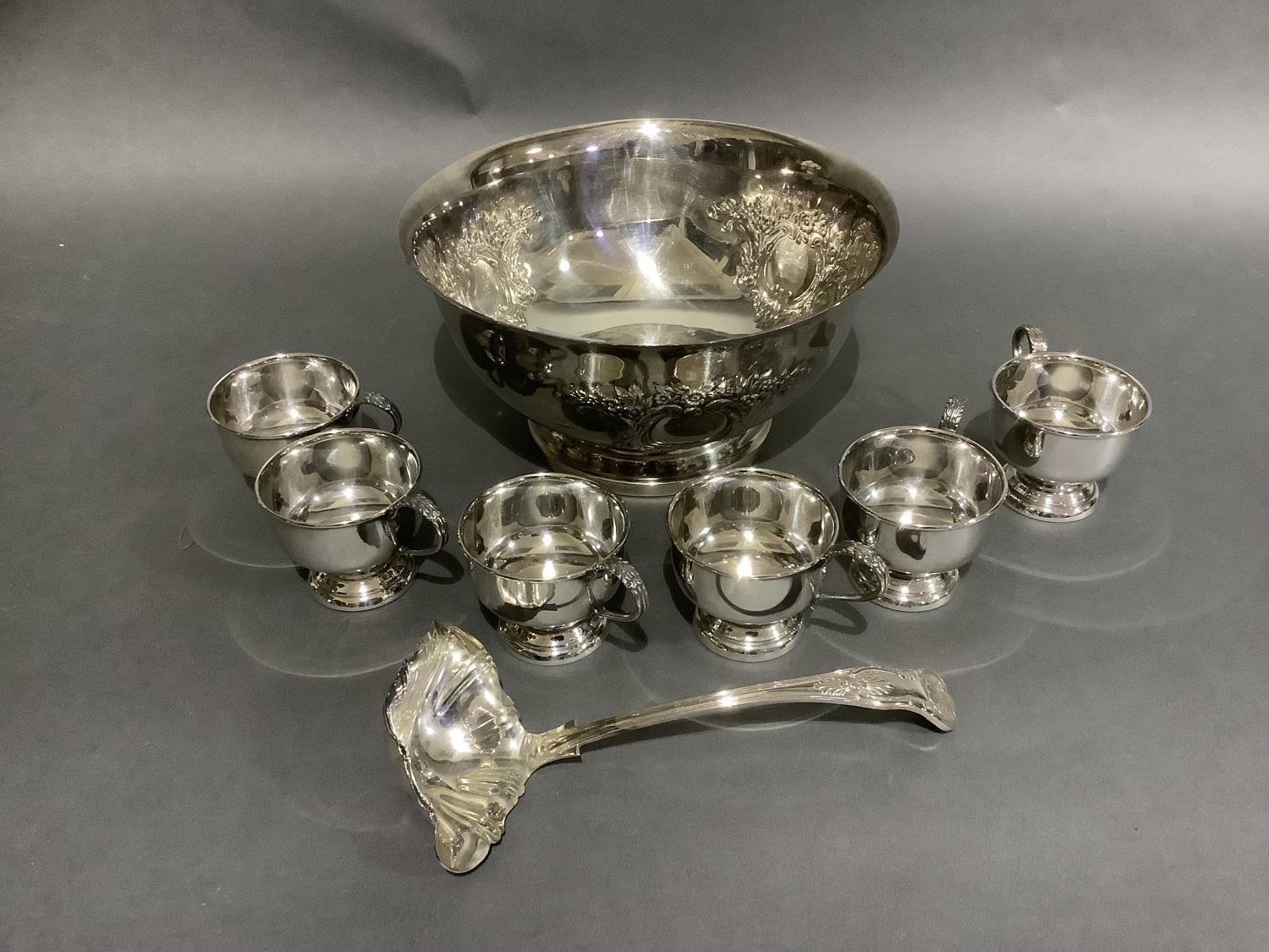 A good silver plated punch bowl with six cups and ladle, embossed with flowers and blind cartouche, - Image 5 of 5