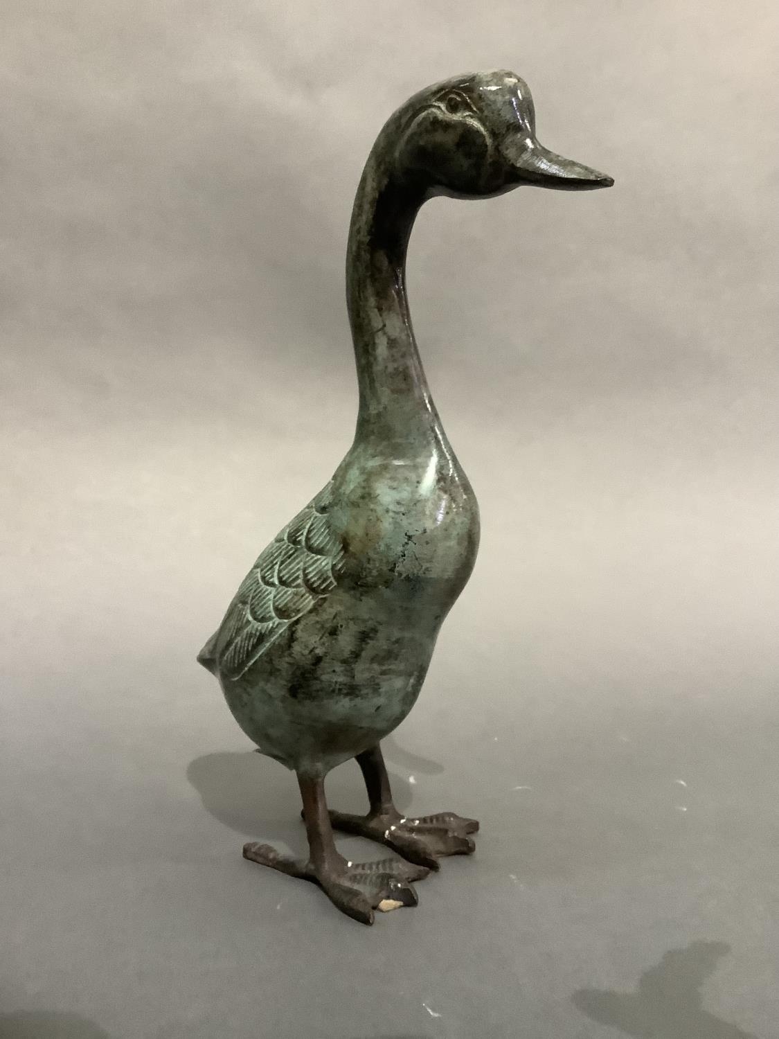 A verdigris bronzed metal figure of a duck, 26.5cm high