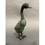 A verdigris bronzed metal figure of a duck, 26.5cm high