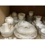 A quantity of white and gilt tea ware, leaf decorated tea ware by Tuscan, meat dish etc