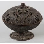 AN 18TH CENTURY CARVED COCONUT SHELL PEDESTAL DISH AND COVER, finely pierced and worked with