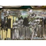 A suite of silver plated cutlery including dinner knives and forks, dessert knives and forks, tea