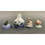 A Royal Copenhagen figure of a robin, 4cm, a frog on a rock, a mermaid and a small vase painted with