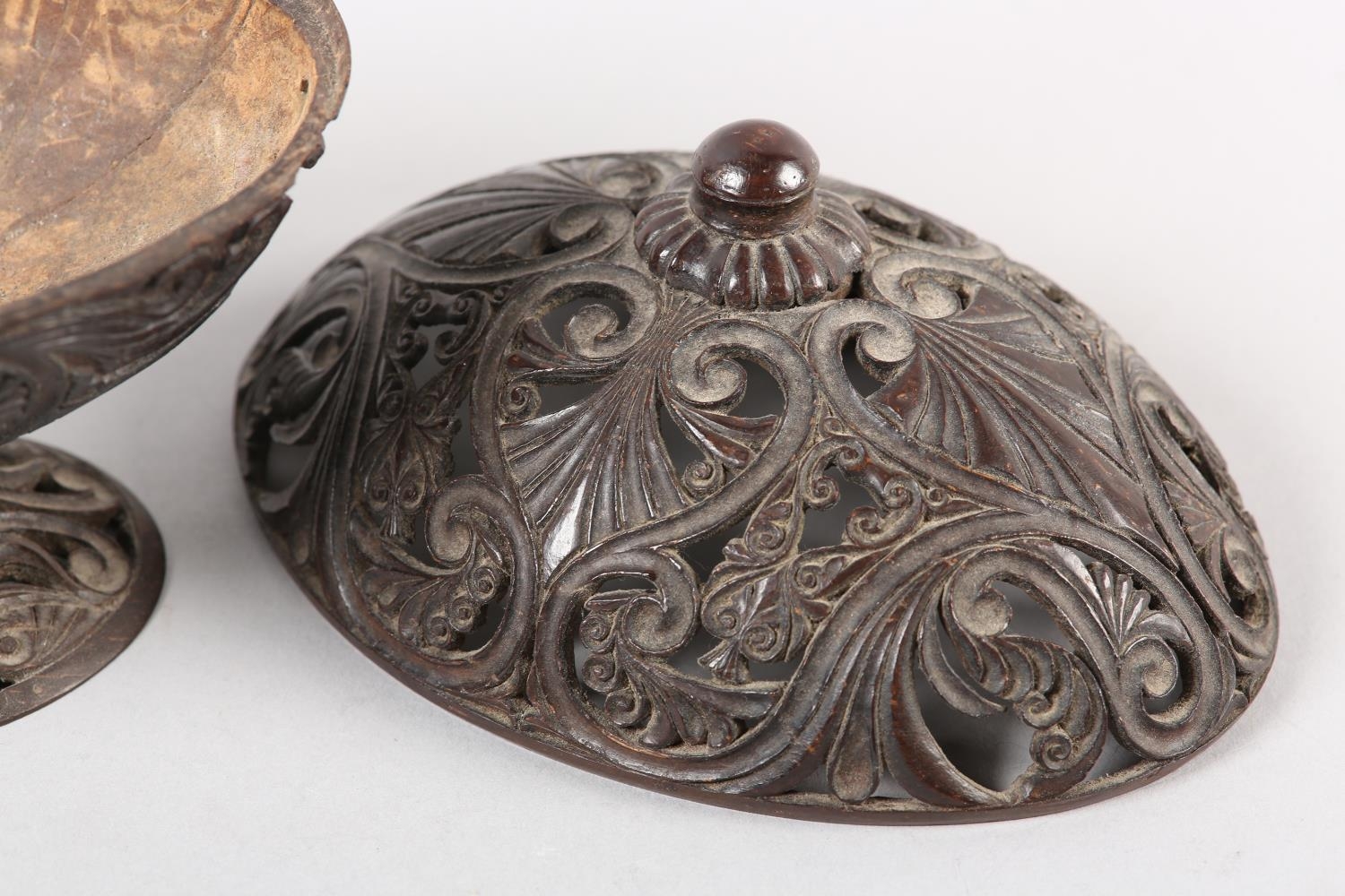 AN 18TH CENTURY CARVED COCONUT SHELL PEDESTAL DISH AND COVER, finely pierced and worked with - Image 5 of 5