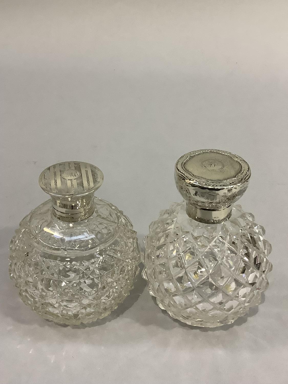 TWO GLOBULAR DIAMOND CUT GLASS SCENT BOTTLES with silver collars and hinged tops, Birmingham 1913 - Image 2 of 3