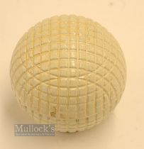 Fine and original and unused moulded mesh large guttie golf ball - with all the original white paint
