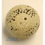 The Opresto 27 ½ bramble pattern guttie golf ball - in unused condition showing most of the original
