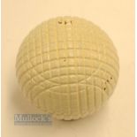 Fine and original and unused moulded mesh small guttie golf ball - unused with all the original